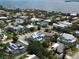 An aerial view displays a community with a waterfront view at 130 50Th St, Holmes Beach, FL 34217