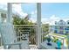 Inviting balcony with two chairs and a scenic view of the neighborhood at 130 50Th St, Holmes Beach, FL 34217