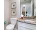 This bathroom features a granite counter and a toilet at 130 50Th St, Holmes Beach, FL 34217