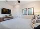 Comfortable bedroom with a television, soft, inviting bed and stylish decor at 130 50Th St, Holmes Beach, FL 34217