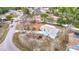 Aerial of a single-Gathering home with driveway and landscaping in a residential area at 13365 Drayton Dr, Spring Hill, FL 34609