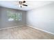 A room with a large window, wood-look tile floor, and neutral paint at 13365 Drayton Dr, Spring Hill, FL 34609