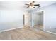 A room with wood-look tile floor and neutral paint with closet and bathroom access at 13365 Drayton Dr, Spring Hill, FL 34609