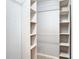 A walk-in closet with multiple shelves and hanging rods at 13365 Drayton Dr, Spring Hill, FL 34609