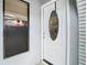 Elegant white front door with decorative glass detailing and sidelight window at 13365 Drayton Dr, Spring Hill, FL 34609