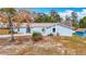 Charming single-story home featuring a well-manicured front yard and inviting entryway at 13365 Drayton Dr, Spring Hill, FL 34609