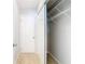Hallway features an adjacent closet with shelving at 13365 Drayton Dr, Spring Hill, FL 34609