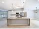 Bright kitchen with a center island, stainless steel appliances, and ample counter space at 13365 Drayton Dr, Spring Hill, FL 34609