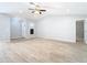 Living room has wood-look tile floors, vaulted ceilings, and a light gray color scheme at 13365 Drayton Dr, Spring Hill, FL 34609