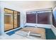Bright sunroom with hot tub, large windows, and view of the back yard at 13365 Drayton Dr, Spring Hill, FL 34609