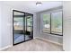 Cozy sunroom with sliding glass doors to the backyard and natural light at 13365 Drayton Dr, Spring Hill, FL 34609