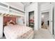 bedroom featuring a bunk bed with built-in storage, and a view of a large closet at 15246 Serene Shores Loop, Bradenton, FL 34211