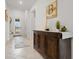 Inviting foyer with a beautiful dark wood sideboard and view of the entryway and outside at 15246 Serene Shores Loop, Bradenton, FL 34211