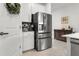 A modern refrigerator and coffee bar area in the kitchen at 15246 Serene Shores Loop, Bradenton, FL 34211