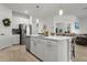 Kitchen featuring a center island with a sink, stainless steel appliances, and an open floor plan at 15246 Serene Shores Loop, Bradenton, FL 34211