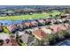 A beautiful aerial shot of homes bordering the water and golf course at 15606 Leven Links Pl, Lakewood Ranch, FL 34202