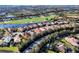 Gorgeous aerial view of homes bordering water and a golf course at 15606 Leven Links Pl, Lakewood Ranch, FL 34202