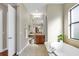 Bright bathroom with a soaking tub, vanity, and a separate toilet room, offering a relaxing space at 15606 Leven Links Pl, Lakewood Ranch, FL 34202