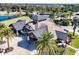 A view of the clubhouse with a beautiful roof and landscaping at 15606 Leven Links Pl, Lakewood Ranch, FL 34202