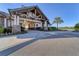 Clubhouse entrance with stone columns and well-manicured landscaping at 15606 Leven Links Pl, Lakewood Ranch, FL 34202