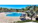 Inviting community pool with a relaxing atmosphere, surrounded by lush landscaping and comfortable lounging areas at 15606 Leven Links Pl, Lakewood Ranch, FL 34202