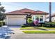 Inviting single-Gathering home with a two-car garage and a well-manicured lawn at 15606 Leven Links Pl, Lakewood Ranch, FL 34202