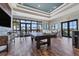 Game room with a pool table, tiled floors, and large windows at 15606 Leven Links Pl, Lakewood Ranch, FL 34202