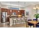 Well-equipped kitchen boasts stainless steel appliances and stylish counter seating at 15606 Leven Links Pl, Lakewood Ranch, FL 34202