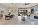 Bright living room featuring stylish furniture, neutral color palette, and large sliding glass doors to outside at 15606 Leven Links Pl, Lakewood Ranch, FL 34202