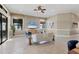 Bright living room featuring a light sofa and stylish chairs at 15606 Leven Links Pl, Lakewood Ranch, FL 34202