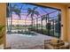 Covered patio with a pool and view of the golf course, perfect for entertaining at 15606 Leven Links Pl, Lakewood Ranch, FL 34202