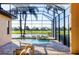 Screened-in pool with lake and golf course views at 15606 Leven Links Pl, Lakewood Ranch, FL 34202