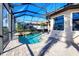 Inviting screened-in pool with a brick paver deck, offering a relaxing outdoor space at 15606 Leven Links Pl, Lakewood Ranch, FL 34202