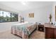 Comfortable bedroom featuring a cozy bed, and window overlooking a green landscape at 1615 Clower Creek Dr # 177, Sarasota, FL 34231