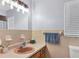 Bathroom featuring a sink, mirror, toilet, and window at 1622 17Th E St, Bradenton, FL 34208