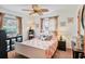 Bedroom with natural light, a ceiling fan, and decorative coral artwork at 1622 17Th E St, Bradenton, FL 34208