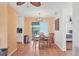 Dining area with neutral paint colors and an adjacent slider to the screened lanai at 1622 17Th E St, Bradenton, FL 34208