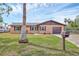 Charming single-story home with well-manicured lawn and an attached garage at 1622 17Th E St, Bradenton, FL 34208