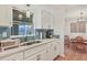 Bright kitchen with white cabinets, stainless steel appliances, and a large sink at 1622 17Th E St, Bradenton, FL 34208