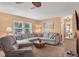 Living room with a large sectional sofa, perfect for relaxing or entertaining guests at 1622 17Th E St, Bradenton, FL 34208