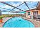 Lovely view of the outdoor pool area, featuring a grill and comfortable seating area at 1622 17Th E St, Bradenton, FL 34208