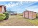 View of the backyard shed with access to the screened-in pool area at 1622 17Th E St, Bradenton, FL 34208