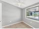 A bedroom with neutral walls and a large window that lets in natural light at 2121 Florinda St, Sarasota, FL 34231