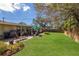 Well-maintained backyard with lush green lawn, patio, and seating area at 3053 Concord St, Sarasota, FL 34231