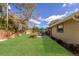 Expansive backyard with lush green grass, wooden fence, and patio area at 3053 Concord St, Sarasota, FL 34231
