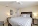 Comfortable bedroom features a large bed, modern decor, and a view into the hallway at 3053 Concord St, Sarasota, FL 34231