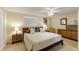 Comfortable bedroom featuring a large bed with modern decor, neutral tones, and ample storage space at 3053 Concord St, Sarasota, FL 34231