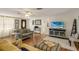 Open-concept living room with wood flooring, modern furniture, and ample natural light at 3053 Concord St, Sarasota, FL 34231