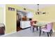 Dining area includes a glass table with upholstered chairs and an adjacent kitchen at 3208 Vivienda Blvd, Bradenton, FL 34207