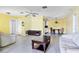 Bright living room features neutral tile flooring, ceiling fan and furniture at 3208 Vivienda Blvd, Bradenton, FL 34207